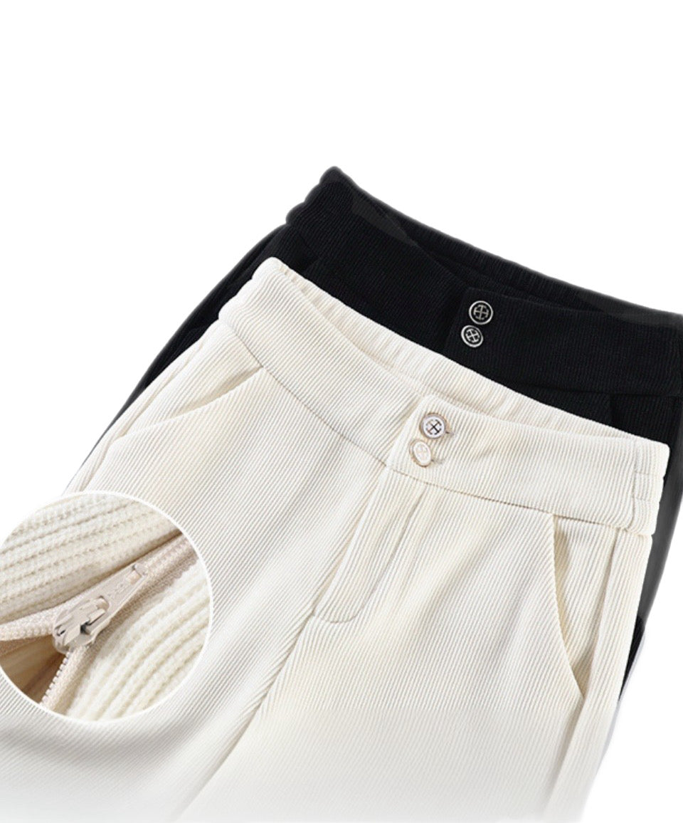 Women’s crop top cardigan with high waisted trousers & handbag outfit