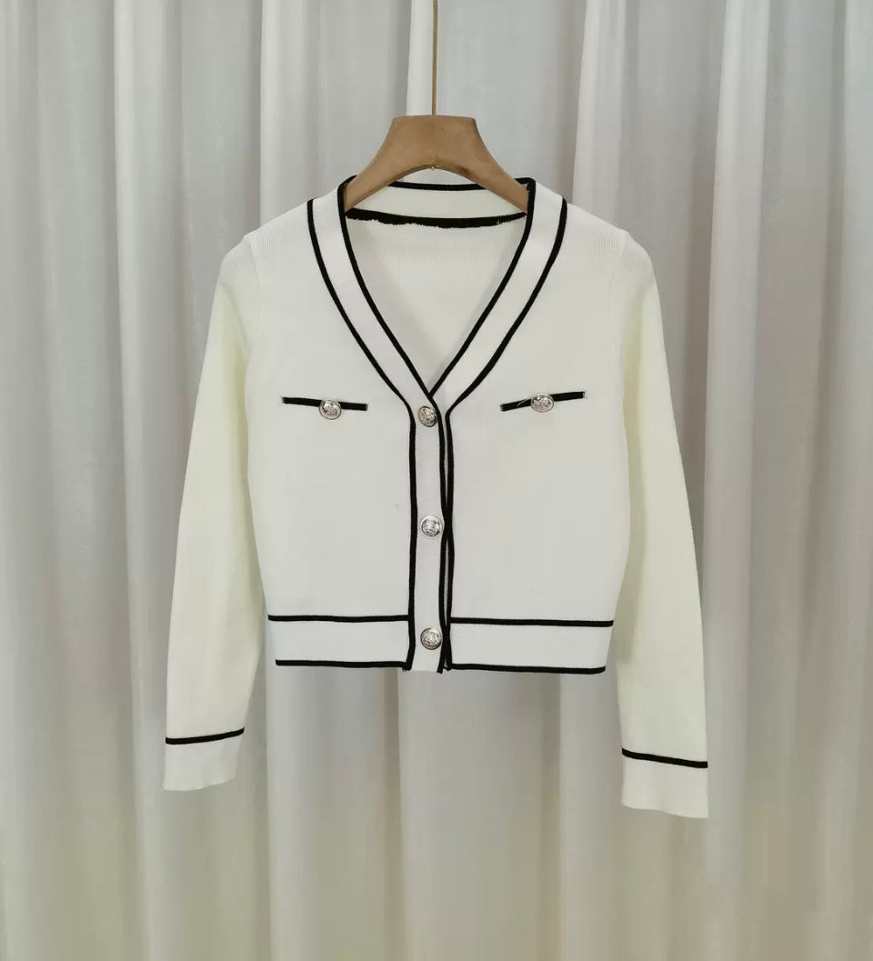 Women’s crop top cardigan with high waisted trousers & handbag outfit